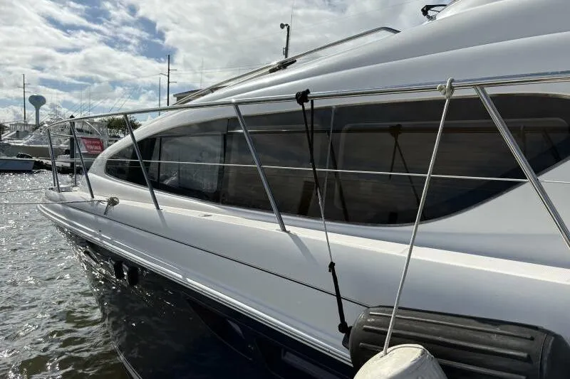 Slide: The Image of 2006 Sea Ray 40 Motor Yacht docked, showcasing sleek design and modern features. - 7