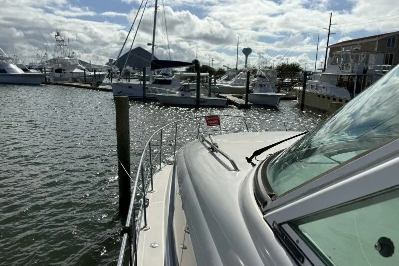Slide: The Image of 2006 Sea Ray 40 Motor Yacht docked at marina under cloudy sky. - 9