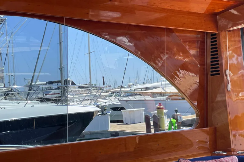 Slide: The Image of Reflection of marina through window of 2017 Hinckley Talaria 43 Motoryacht. - 13