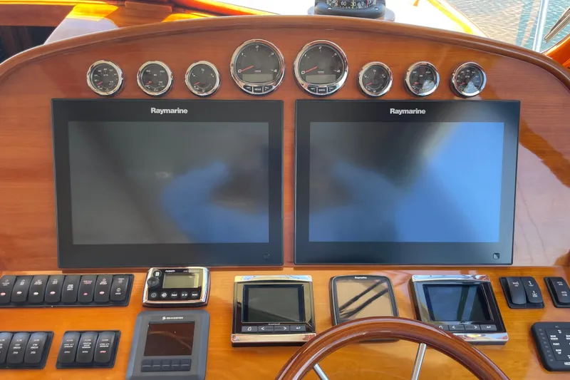 Slide: The Image of Hinckley Talaria 43 Motoryacht 2017 dashboard with Raymarine displays and control panels. - 15
