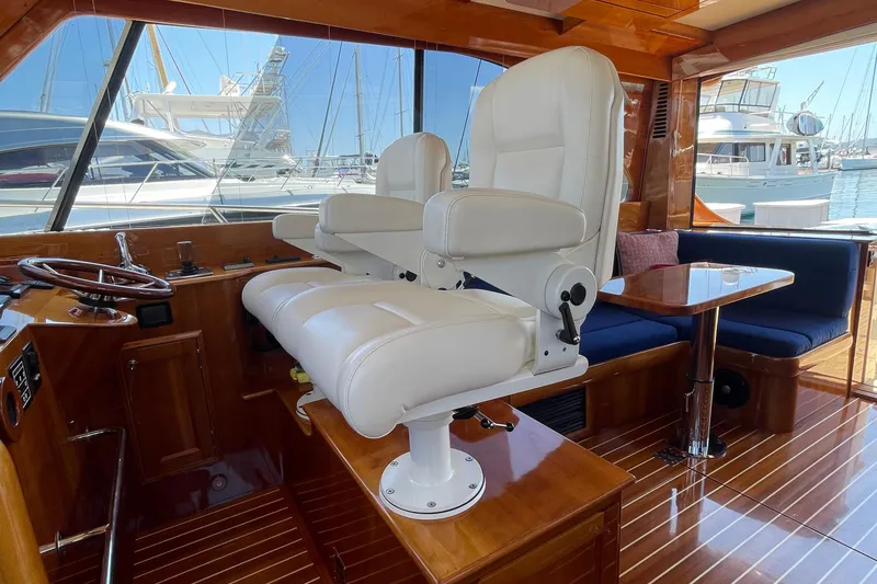 Slide: The Image of Interior of 2017 Hinckley Talaria 43 Motoryacht with luxurious seating and wooden finishes. - 18