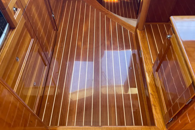 Slide: The Image of Polished wooden interior of 2017 Hinckley Talaria 43 Motoryacht, showcasing elegant craftsmanship. - 27