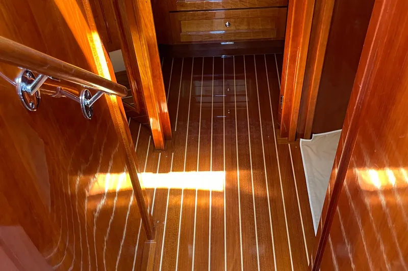 Slide: The Image of Luxurious wooden interior of 2017 Hinckley Talaria 43 Motoryacht, featuring polished floors and cabinetry. - 28