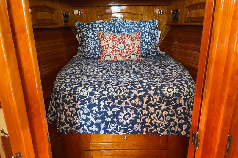 Slide: The Image of Cozy cabin interior of 2017 Hinckley Talaria 43 Motoryacht with floral bedding. - 32