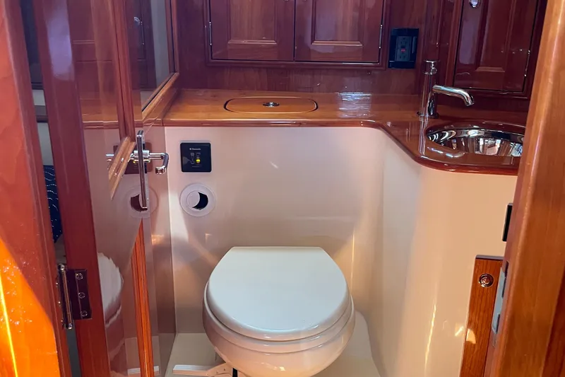 Slide: The Image of Luxurious bathroom interior of 2017 Hinckley Talaria 43 Motoryacht with wooden cabinetry. - 35