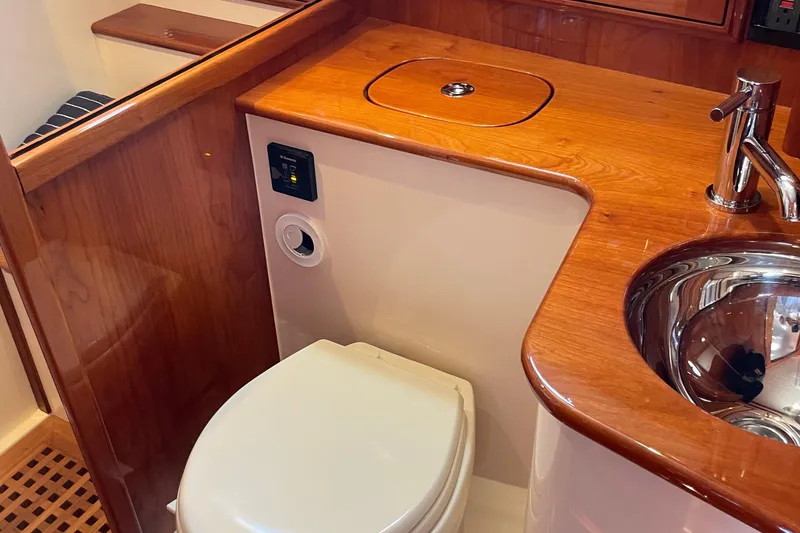 Slide: The Image of Luxurious bathroom interior of 2017 Hinckley Talaria 43 Motoryacht with wood accents and modern fixtures. - 36