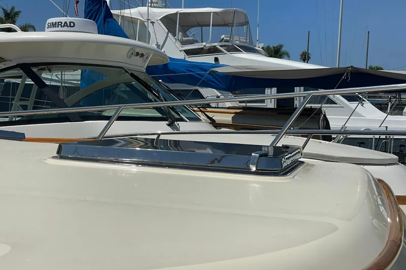 Slide: The Image of 2017 Hinckley Talaria 43 Motoryacht with sleek design and modern features docked at marina. - 40