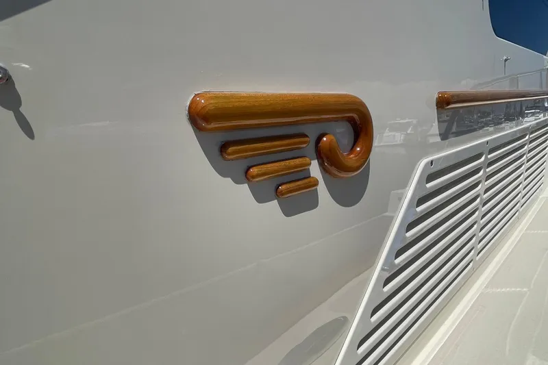 Slide: The Image of 2017 Hinckley Talaria 43 Motoryacht, elegant wood detailing on sleek exterior design. - 42