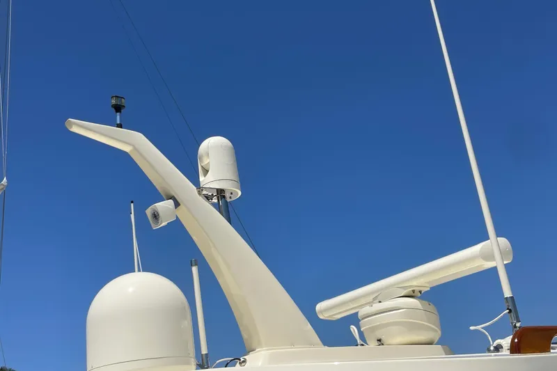 Slide: The Image of Hinckley Talaria 43 Motoryacht 2017 radar and communication equipment against clear blue sky. - 47