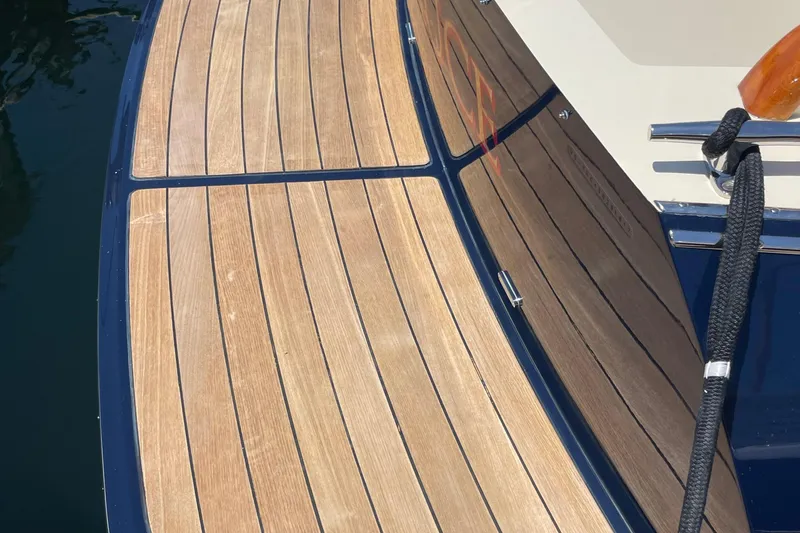 Slide: The Image of Teak deck of 2017 Hinckley Talaria 43 Motoryacht with polished finish and mooring line. - 49