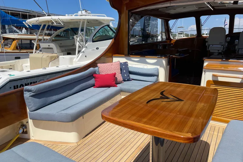Slide: The Image of Luxurious 2017 Hinckley Talaria 43 Motoryacht interior with elegant seating and wooden table. - 5