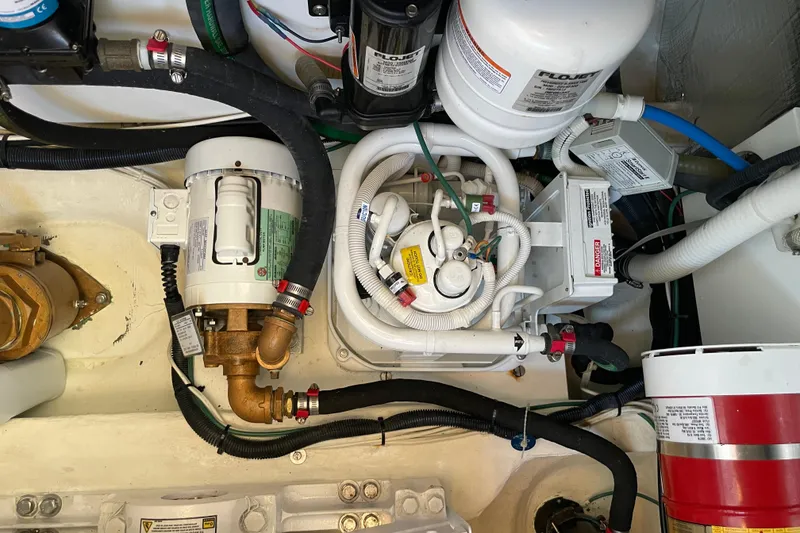 Slide: The Image of Engine room of 2017 Hinckley Talaria 43 Motoryacht with mechanical components and wiring. - 54