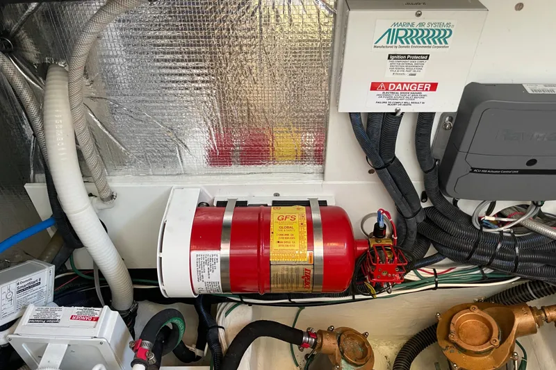 Slide: The Image of Engine room of 2017 Hinckley Talaria 43 Motoryacht with fire suppression system and wiring. - 55