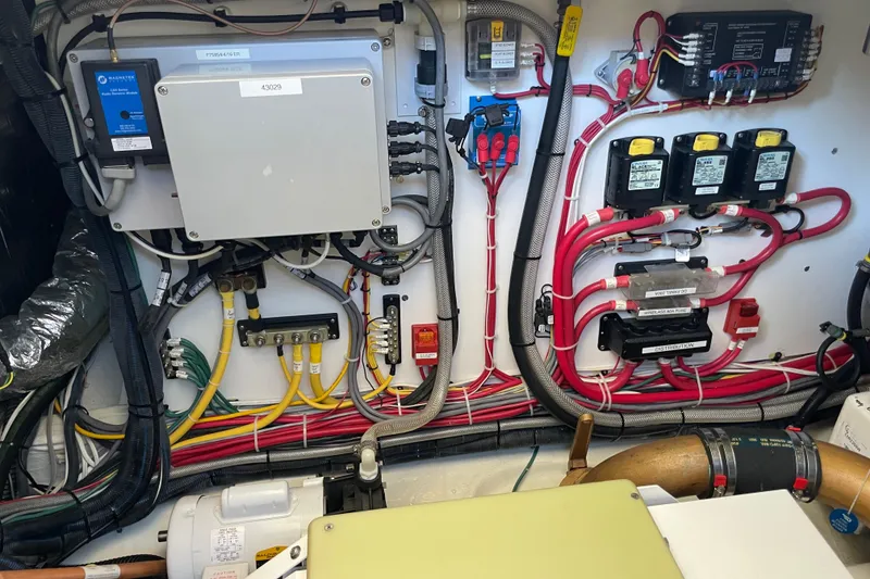 Slide: The Image of Electrical system of a 2017 Hinckley Talaria 43 Motoryacht, showcasing organized wiring and components. - 56