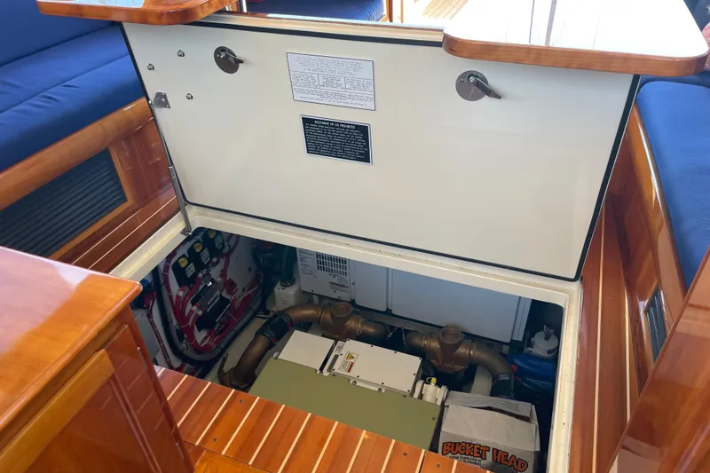Slide: The Image of Engine compartment of 2017 Hinckley Talaria 43 Motoryacht with open hatch and visible components. - 57