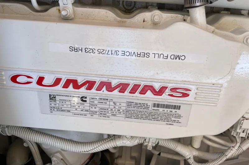 Slide: The Image of Engine compartment of 2017 Hinckley Talaria 43 Motoryacht with Cummins branding. - 58
