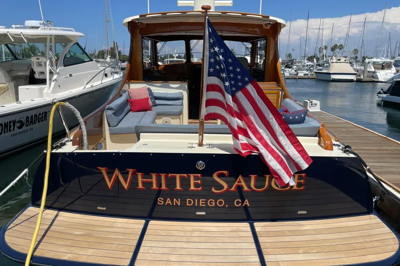 Slide: The Image of Hinckley Talaria 43 Motoryacht 2017, named "White Sauce," docked in San Diego marina. - 61