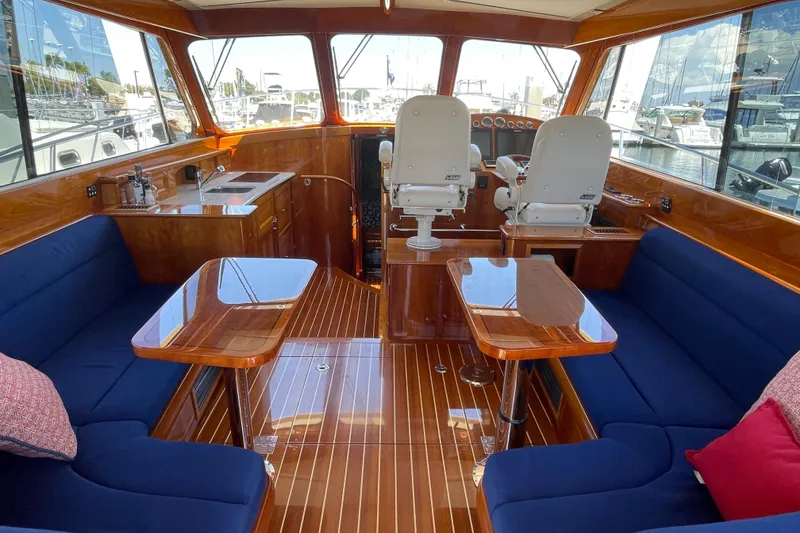 Slide: The Image of Luxurious interior of 2017 Hinckley Talaria 43 Motoryacht with elegant wood finish and plush seating. - 7