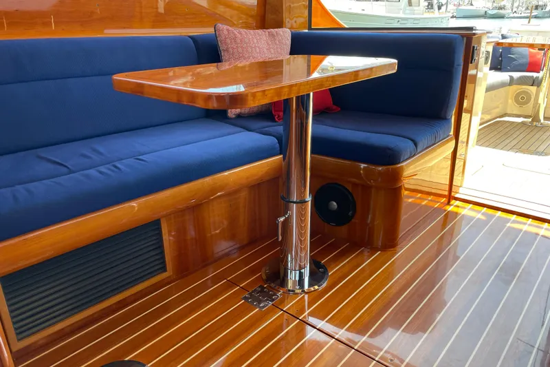 Slide: The Image of Luxurious interior of 2017 Hinckley Talaria 43 Motoryacht with polished wood and blue seating. - 9