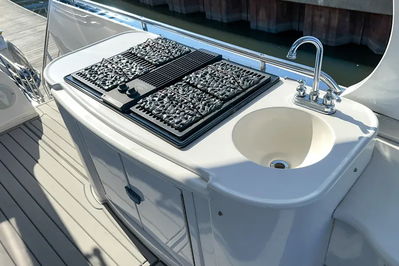 Slide: The Image of Outdoor kitchen on 2012 Bluewater 5200 Custom Series Yacht with grill and sink. - 25