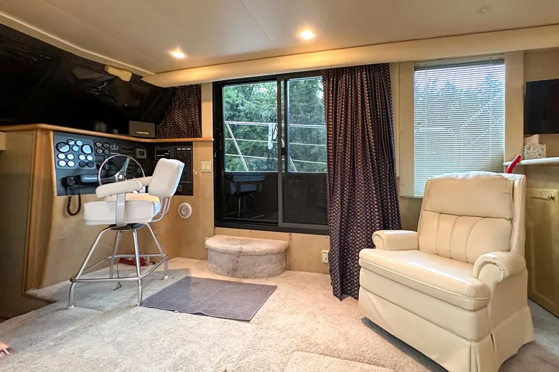 Slide: The Image of Interior of 2012 Bluewater 5200 Custom Series Yacht with helm and seating area. - 27