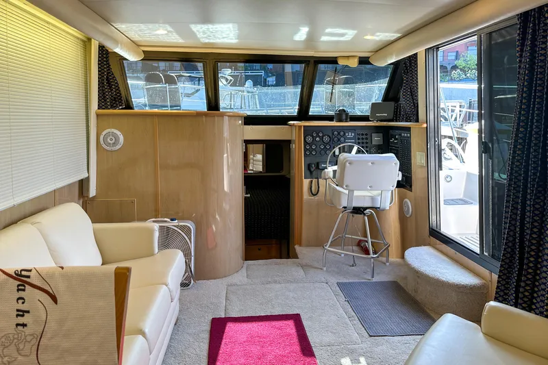 Slide: The Image of Luxurious interior of 2012 Bluewater 5200 Custom Series Yacht with helm and seating area. - 28