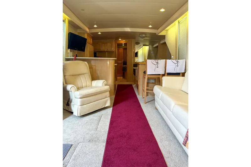 Slide: The Image of Luxurious interior of 2012 Bluewater 5200 Custom Series Yacht with plush seating and modern amenities. - 31