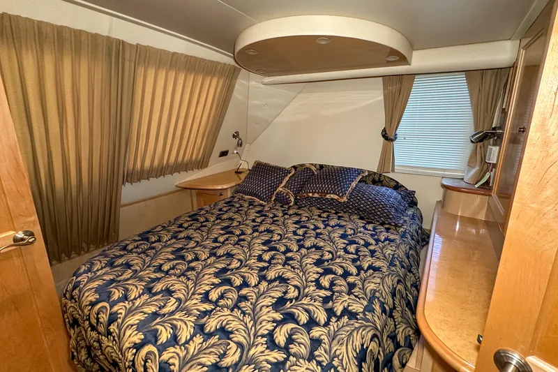 Slide: The Image of Luxurious bedroom interior of 2012 Bluewater 5200 Custom Series Yacht with elegant bedding. - 35