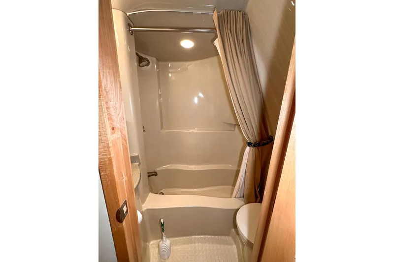 Slide: The Image of Bathroom interior of 2012 Bluewater 5200 Custom Series Yacht with shower and toilet. - 37