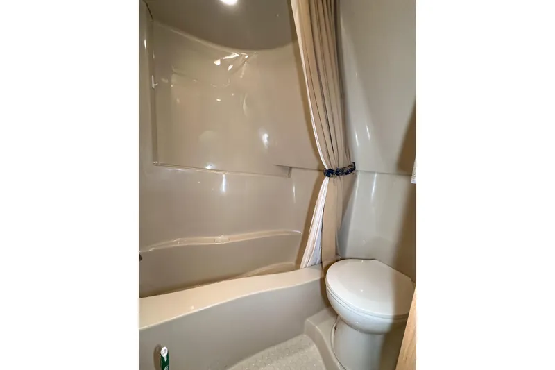Slide: The Image of Bathroom interior of 2012 Bluewater 5200 Custom Series Yacht with shower and toilet. - 39