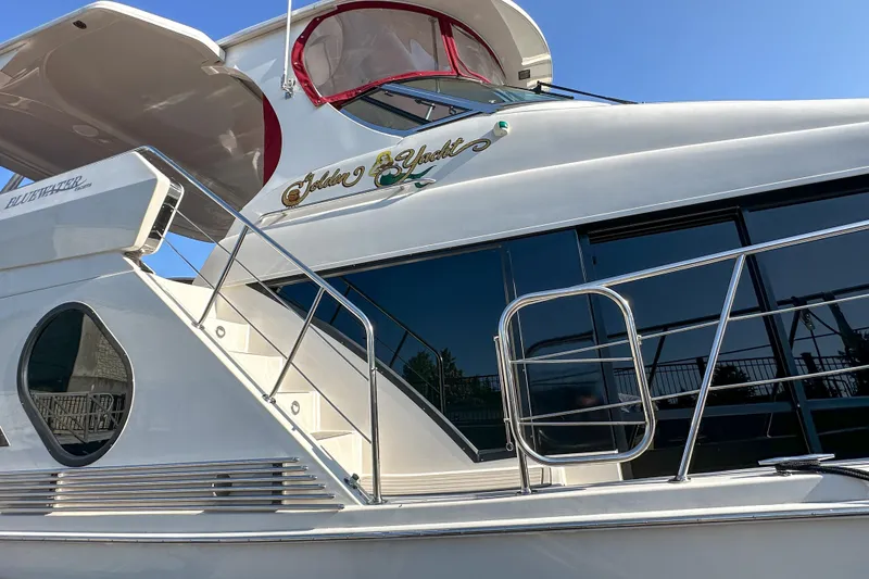 Slide: The Image of Luxury Bluewater 5200 yacht, 2012 model, featuring sleek design and modern amenities. - 5