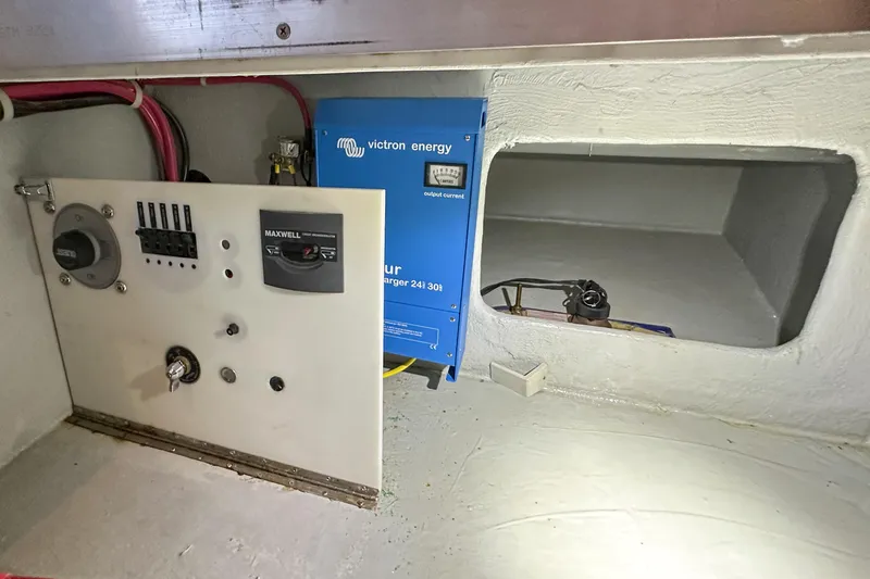 Slide: The Image of Electrical panel and Victron Energy charger inside 2012 Bluewater 5200 Custom Series Yacht. - 51