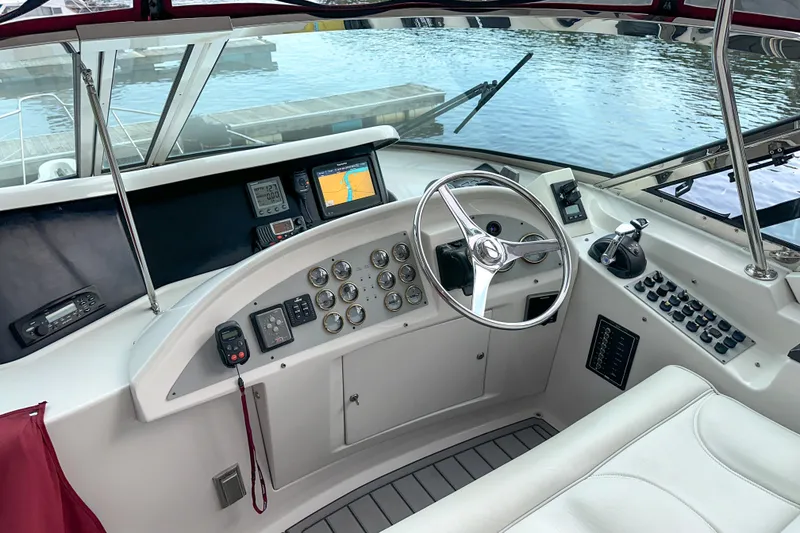 Slide: The Image of Helm of 2012 Bluewater 5200 yacht with modern navigation instruments and controls. - 9