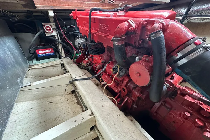 Slide: The Image of Red marine engine in a 1973 CHB 34 boat with Duralast battery. - 41