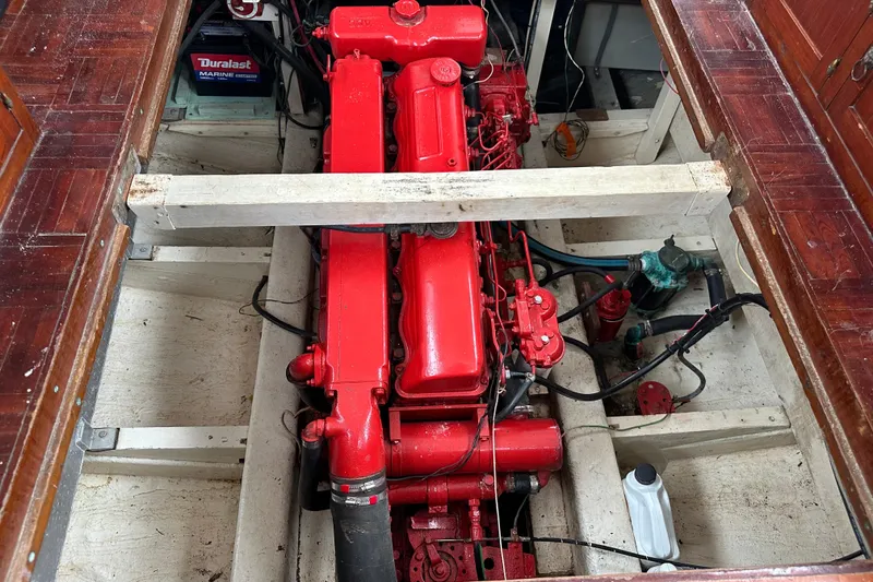Slide: The Image of Red engine in a 1973 CHB 34 boat, with visible wiring and components. - 42