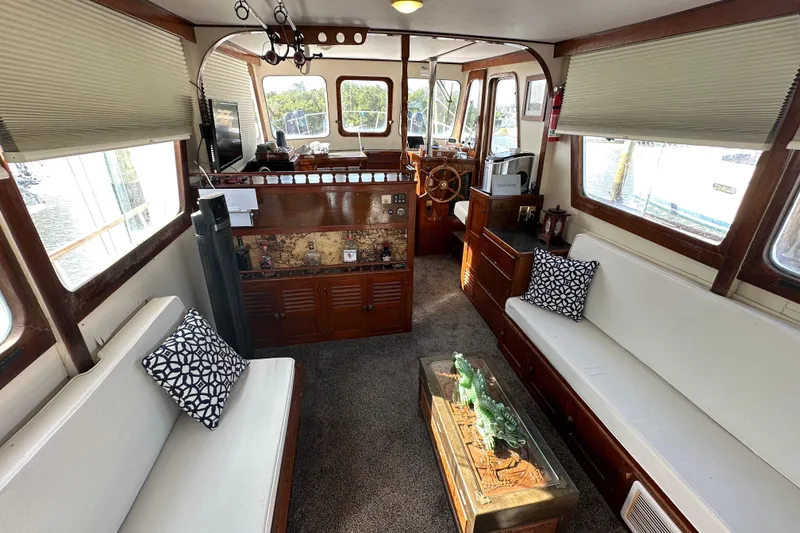 Slide: The Image of Interior of a 1973 CHB 34 boat with cozy seating and nautical decor. - 17