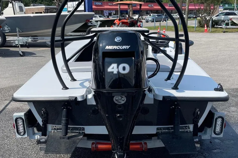 Slide: The Image of 2025 Chittum Skiffs Challenger 18 boat on trailer, close-up view. - 5