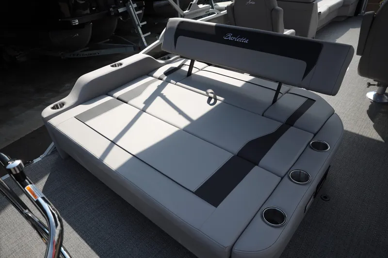 Slide: The Image of 2026 Barletta ARIA 22UC boat interior with luxurious seating and cup holders. - 14