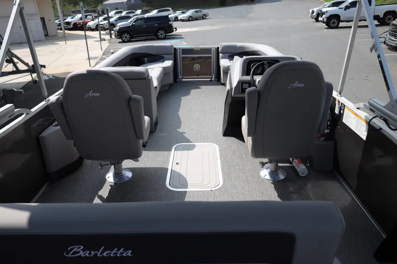 Slide: The Image of 2026 Barletta ARIA 22UC pontoon boat interior with gray seating and modern dashboard. - 15