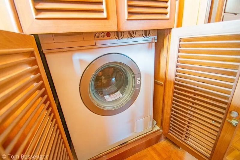 Slide: The Image of Front-loading washing machine in wooden cabinet on Ponderosa 47, 1986 model. - 28