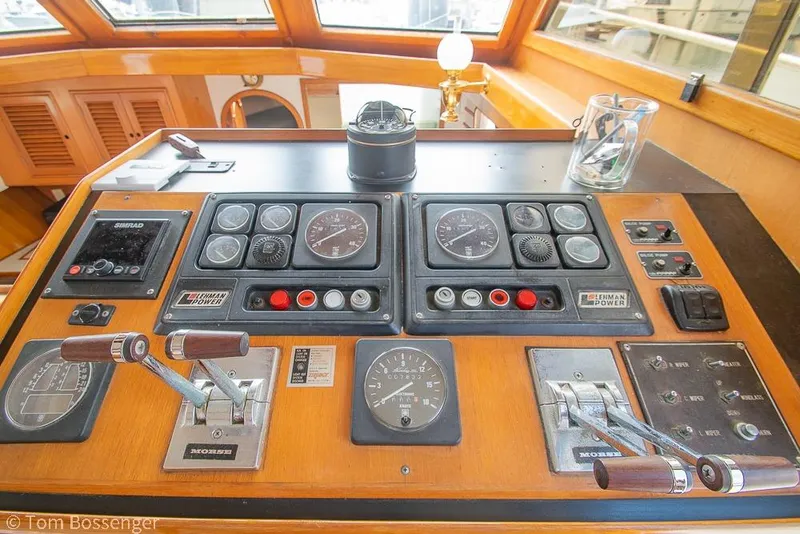 Slide: The Image of Control panel of a 1986 Ponderosa 47 boat with gauges and levers. - 33