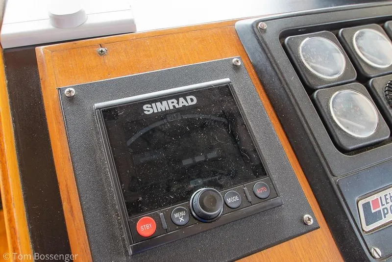 Slide: The Image of Simrad navigation system on 1986 Ponderosa 47 boat dashboard. - 34