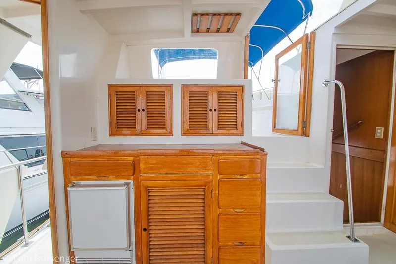 Slide: The Image of Interior of 1986 Ponderosa 47 yacht with wooden cabinetry and white stairs. - 42