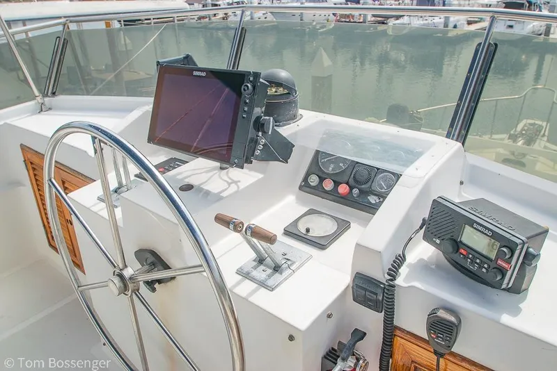 Slide: The Image of Helm of 1986 Ponderosa 47 boat with navigation equipment and steering wheel. - 50