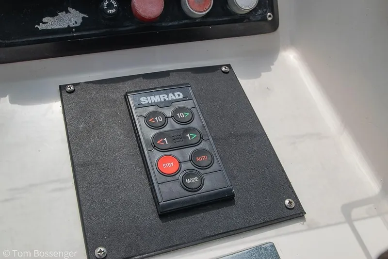 Slide: The Image of Simrad control panel on 1986 Ponderosa 47 boat dashboard. - 52