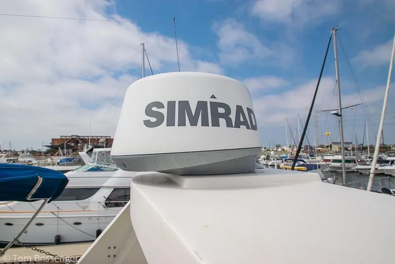 Slide: The Image of Simrad radar on 1986 Ponderosa 47 yacht, docked in a marina. - 56