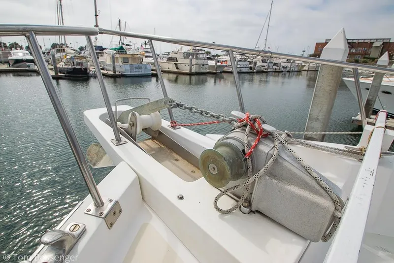 Slide: The Image of Bow of 1986 Ponderosa 47 yacht with anchor and marina view. - 64