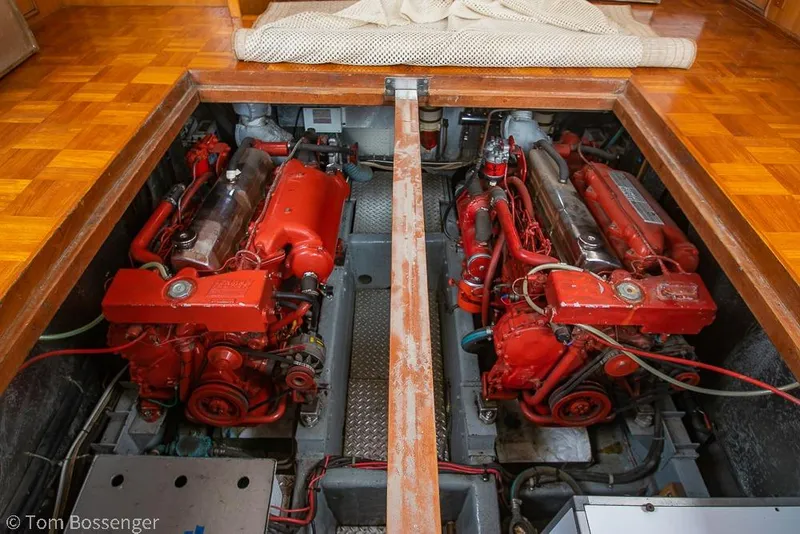 Slide: The Image of Engine room of a 1986 Ponderosa 47 yacht with twin red engines. - 66