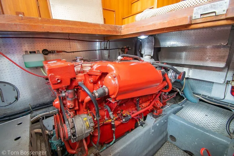 Slide: The Image of Red engine inside a 1986 Ponderosa 47 boat, detailed mechanical components visible. - 70