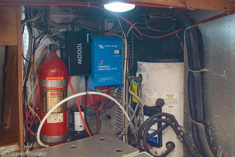 Slide: The Image of Electrical system setup in a 1986 Ponderosa 47 boat, featuring wiring and equipment. - 71